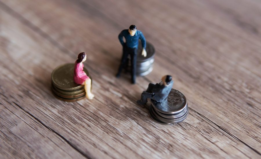 businesspeoplesittingoncoinsandsavingtheirpennies-1920x1280